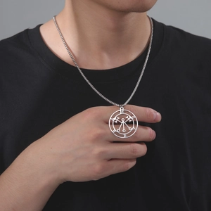 Close-up of a male model wearing a silver stainless steel Marbas sigil pendant on a bead chain