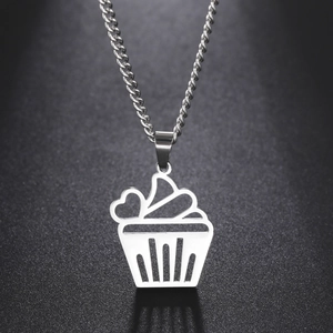 Detailed macro shot of a hollow cupcake pendant necklace made of silver stainless steel