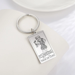 Detailed laser engraving of the Page of Cups tarot card on a silver stainless steel keychain