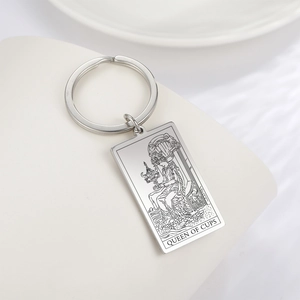 Polished stainless steel Tarot Queen of Cups rectangular keychain pendant on white surface