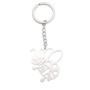 Close-up of silver stainless steel keychain featuring a hollow-out cartoon bee pendant