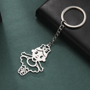 Close-up of a polished stainless steel keychain with a cute hollow ballerina girl pendant