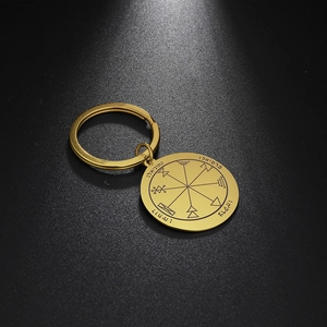 Macro shot of gold plated stainless steel keychain with laser engraved Solomon seal
