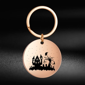 Portachiavi in acciaio inossidabile oro rosa con casa stregata e albero per Halloween