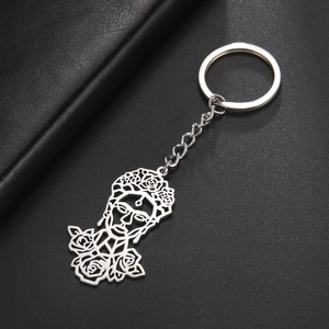 Polished stainless steel keychain featuring a hollow-out Frida Kahlo floral portrait pendant