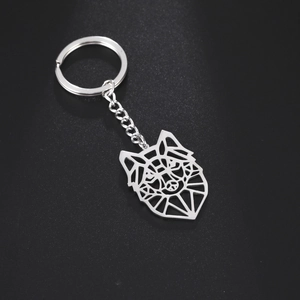 Polished stainless steel keychain featuring a geometric cutout wolf head pendant