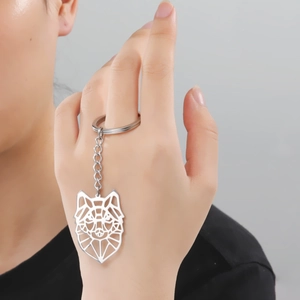 Polished stainless steel keychain with hollow geometric wolf head pendant on a keyring