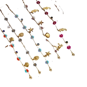 Five-piece set of gold ocean theme bracelets with colorful beads and sea animal charms