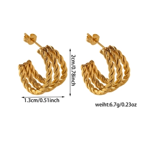 Detail view of gold twisted C-shaped hoop earrings showing size and weight specifications