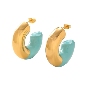 Detailed macro view of chunky golden C-shaped hoop earrings with sky blue enamel finish