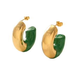 Close-up of gold and green enamel C-shaped chunky hoop earrings with a polished finish