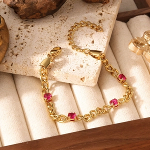 Vintage gold titanium steel bracelet with four round garnet stones and adjustable chain
