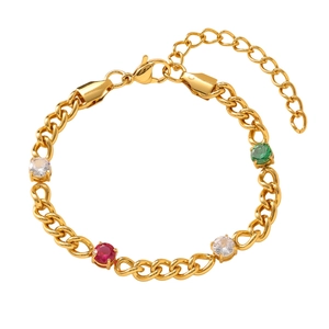 Detail of a gold titanium steel bracelet featuring colorful round gemstones and lobster clasp
