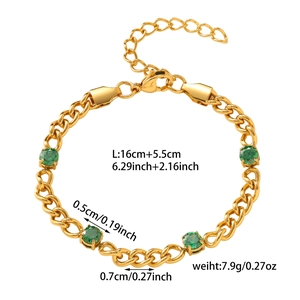 Detail of gold chain bracelet featuring green gemstones and adjustable lobster clasp closure