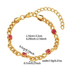 Detail of gold titanium steel bracelet with red oval garnets and adjustable chain