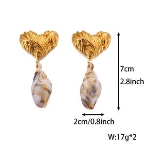 Detailed view of heart shell earrings with dimensions 7cm height and 2cm width