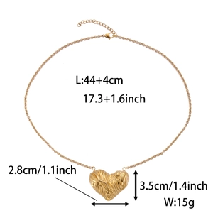 Detail of a gold heart shell pendant necklace with size labels and metal textures