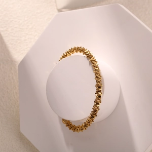 Elegant gold plum blossom branch open bangle with textured grain finish for women