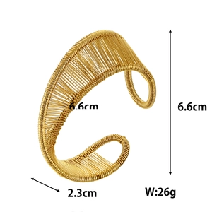 Detail view of gold plum branch cuff bracelet showing 6.6cm diameter and 2.3cm width specs