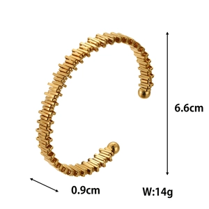 Detail view of gold plum branch cuff bracelet with dimensions 6.6cm height and 14g weight