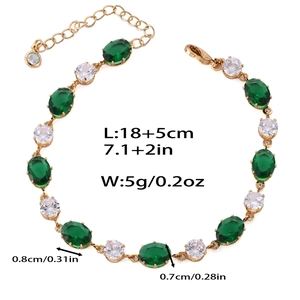 Vue détaillée d'un bracelet doré avec zircons vert émeraude et mesures de taille