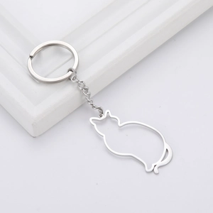 Detailed close-up of a hollow cat silhouette pendant on a silver stainless steel keychain