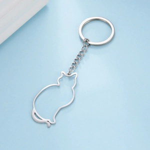 Close-up of a silver stainless steel keychain featuring a hollow-out cat silhouette pendant