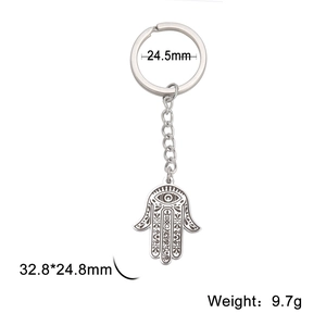 Titanium steel Hamsa Hand keychain featuring intricate geometric patterns and evil eye