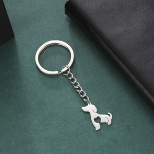 Detailed view of a silver stainless steel dog keychain with a heart cutout design
