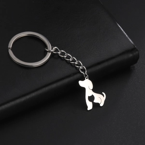 Detail of silver stainless steel keychain featuring a hollow dog and cat silhouette pendant