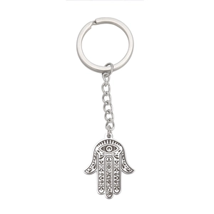 Silver stainless steel Hamsa Hand keychain featuring Evil Eye and floral motifs on white background