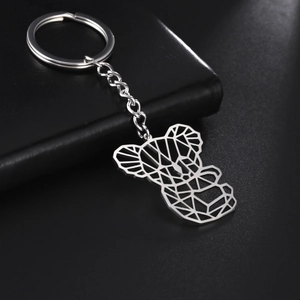 Macro shot of silver stainless steel keychain featuring a geometric hollow koala pendant
