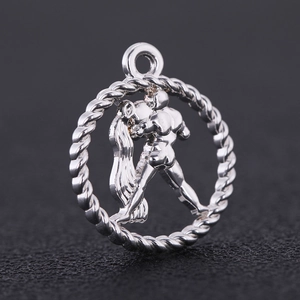 Macro view of silver alloy Aquarius zodiac pendant with hollowed-out relief design