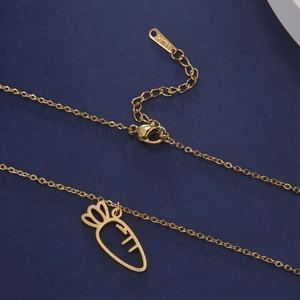 Detail view of gold stainless steel necklace with carrot pendant and lobster clasp