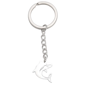 Polished stainless steel shark pendant keychain with hollow design on white background