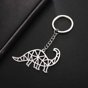 Detail of silver brachiosaurus keychain with geometric hollow-out stainless steel design
