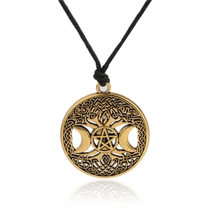 Detailed close-up of bronze alloy pentagram moon pendant with Celtic knotwork design