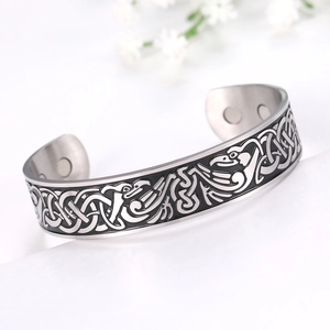 Detail view of 304 stainless steel bracelet with vintage bird motifs and internal magnets