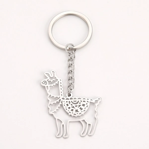 Detail of laser-cut alpaca pendant on a silver stainless steel keychain with chain