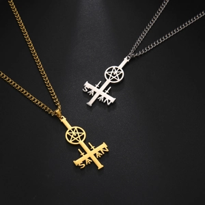 Close-up of gold and silver inverted cross pentagram pendants with Satan engraving