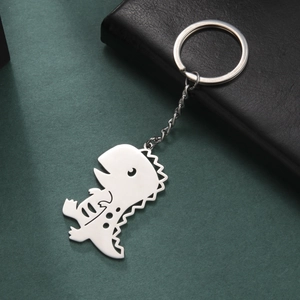 Polished silver stainless steel dinosaur pendant keychain with hollow bone details