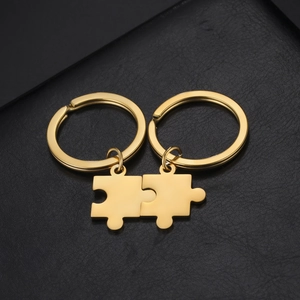 Porte-clés puzzle en acier inoxydable doré poli avec finition miroir sur cuir