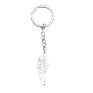 Polished stainless steel wing pendant keychain with fine feather details on white background