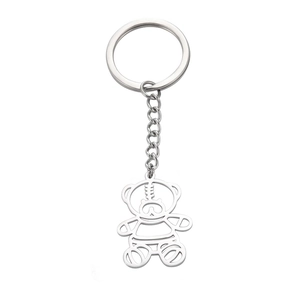 Creative minimalist hollow bear metal keychain with polished silver finish on white background