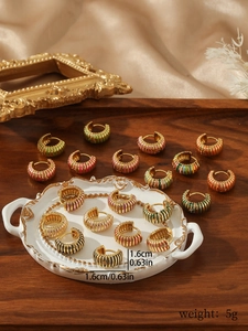 Detail view of retro colorful rainbow hoop earrings with gold finish and 1.6cm diameter