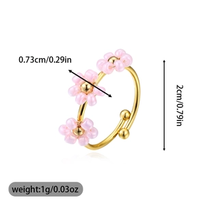 Size specifications of adjustable gold ring with pink beaded flowers and weight details
