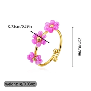 Detail showing dimensions of floral open ring with purple beads on gold-plated metal