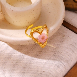 Adjustable golden stainless steel ring with heart frame and small pink dried flower