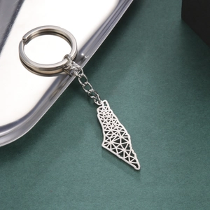 Detail of silver stainless steel keychain featuring a geometric cutout Israel map pendant