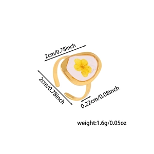 Detail view of adjustable gold ring with preserved yellow flower and size measurements